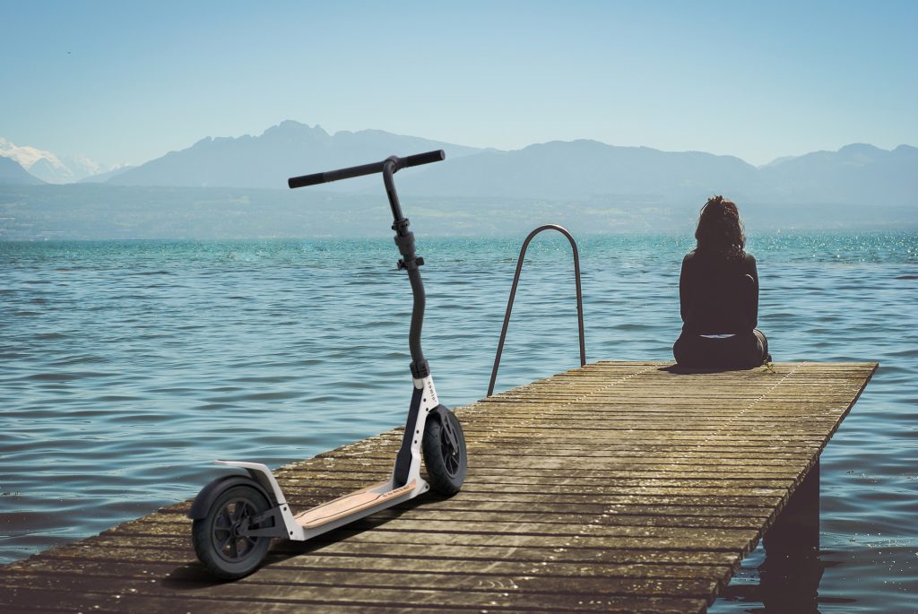 comin scooter, mobility design, prototype rear view at a lake